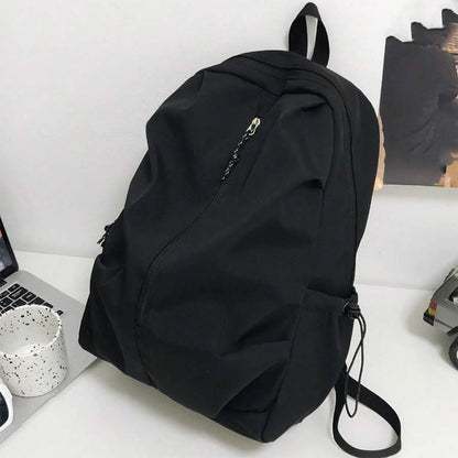 iskolatáska hátizsák, nylon anyagból, laptoprekesszel, oldalnézetben
